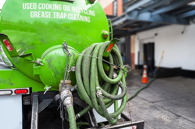 workers at Grease Trap Cleaning of Commack